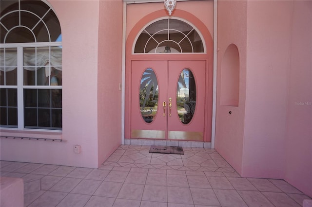 doorway to property with stucco siding