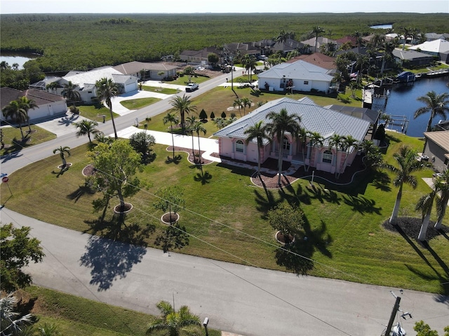 aerial view with a residential view and a water view