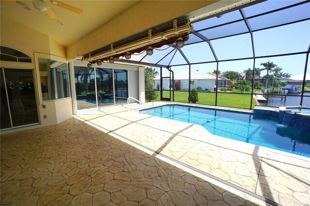 649 Maltese Dr, Punta Gorda, FL 33950 - view of swimming pool featuring a patio area, a ceiling fan, a lanai, a yard, and a pool with connected hot tub