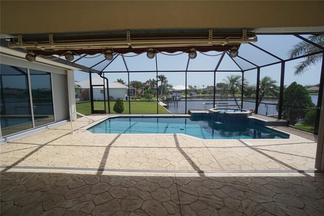 649 Maltese Dr, Punta Gorda, FL 33950 - view of swimming pool featuring glass enclosure, a patio, a water view, and a pool with connected hot tub