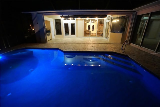 649 Maltese Dr, Punta Gorda, FL 33950 - pool at twilight featuring an outdoor pool, french doors, and a patio