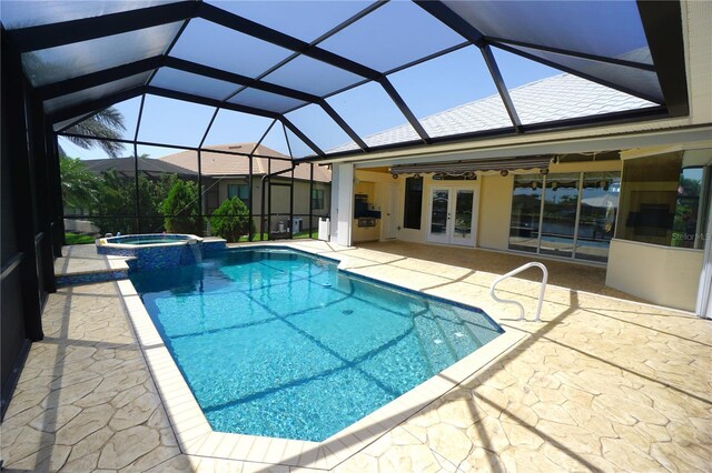 649 Maltese Dr, Punta Gorda, FL 33950 - view of swimming pool featuring french doors, a patio area, a pool with connected hot tub, and a lanai