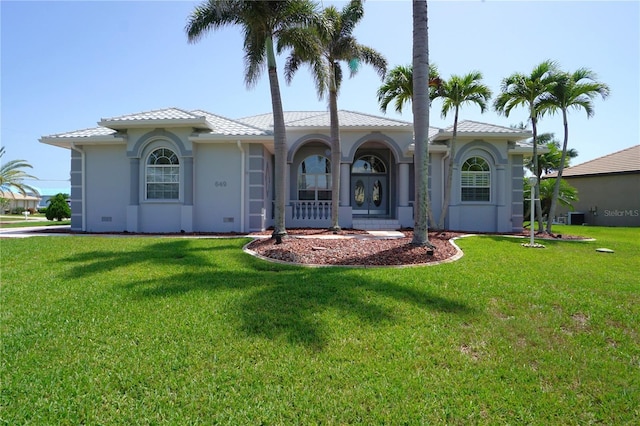 649 Maltese Dr, Punta Gorda, FL 33950 - mediterranean / spanish home with a front lawn, stucco siding, and cooling unit