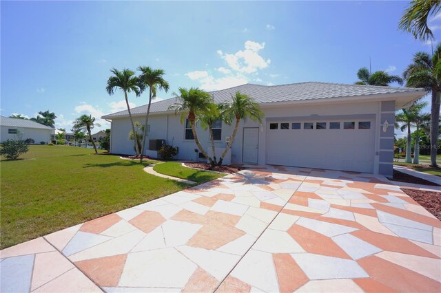 649 Maltese Dr, Punta Gorda, FL 33950 - ranch-style home with a tile roof, a garage, concrete driveway, a front lawn, and stucco siding
