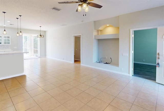 interior space with ceiling fan and light tile patterned floors