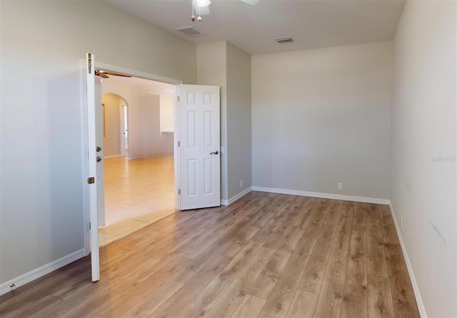 spare room featuring light hardwood / wood-style floors