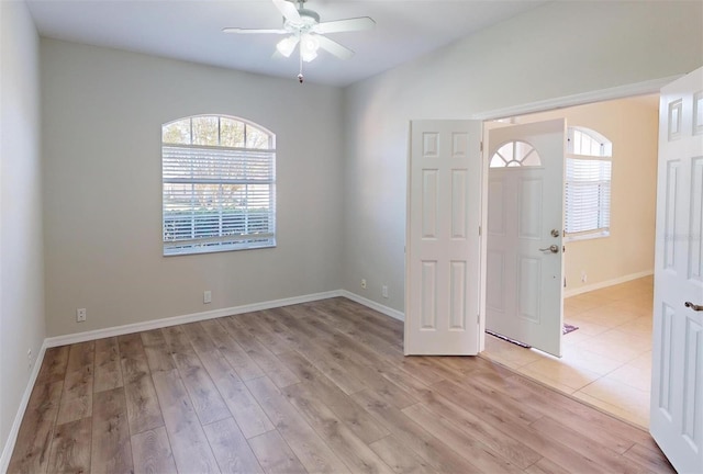 entryway featuring light wood-type flooring and ceiling fan