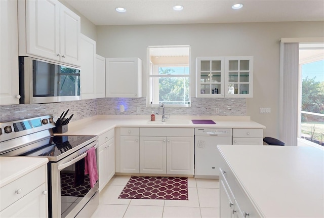 kitchen featuring white cabinetry, plenty of natural light, and appliances with stainless steel finishes