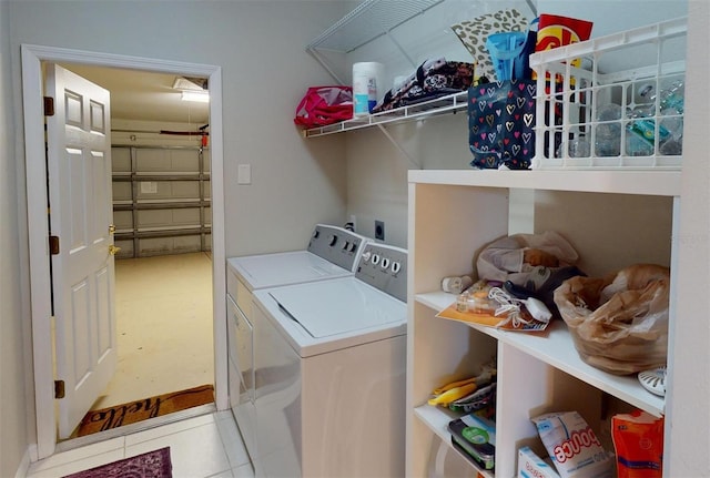 laundry area featuring tile patterned floors and separate washer and dryer