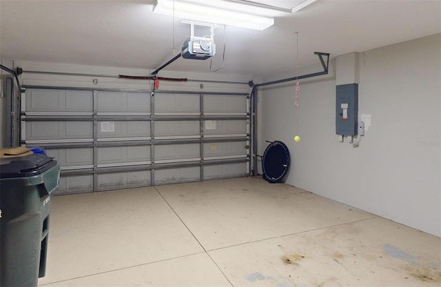 garage featuring electric panel and a garage door opener