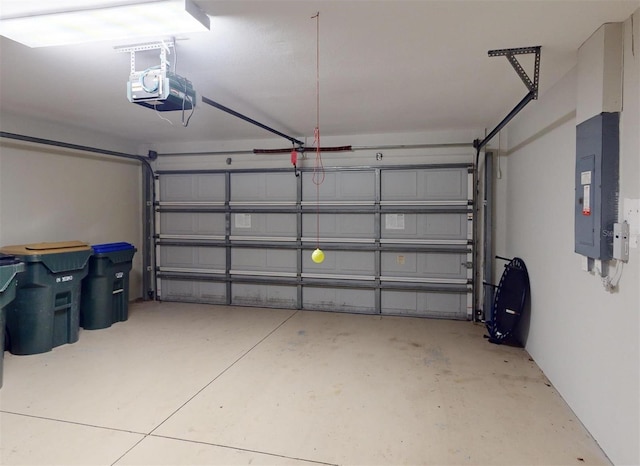 garage with electric panel and a garage door opener