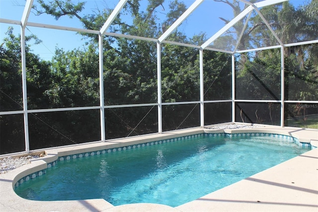 view of pool featuring a lanai and a patio