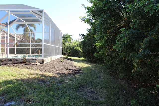 view of yard with a lanai