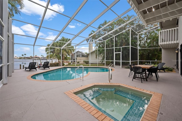 view of pool featuring glass enclosure and a patio area