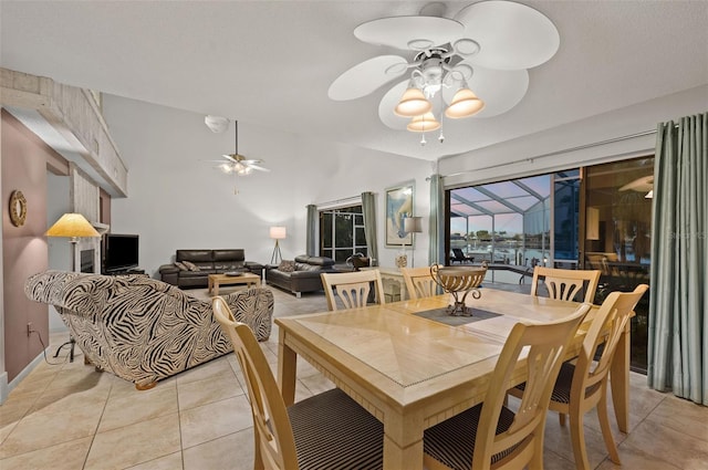 dining room with ceiling fan and light tile patterned floors