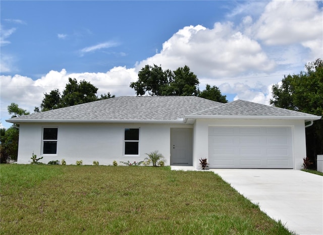 single story home with a front yard and a garage