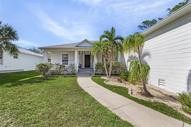 view of front of property with a porch and a front lawn