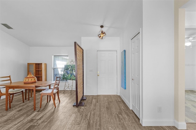 foyer entrance featuring ceiling fan and hardwood / wood-style flooring