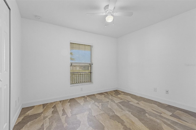 unfurnished room with ceiling fan