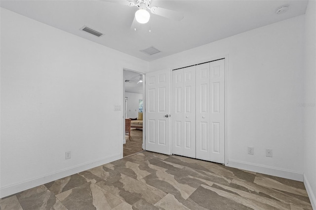 unfurnished bedroom featuring a closet and ceiling fan