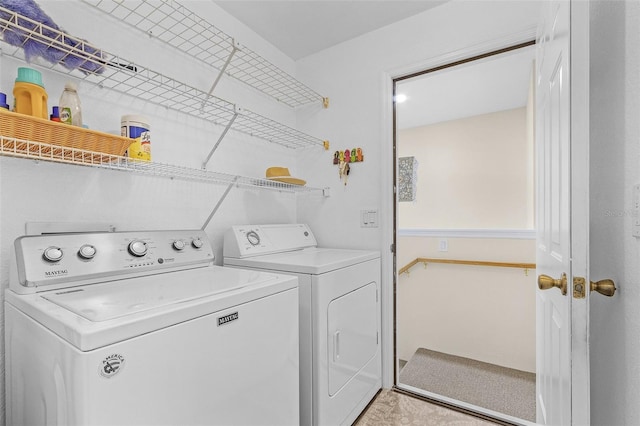 laundry area with separate washer and dryer