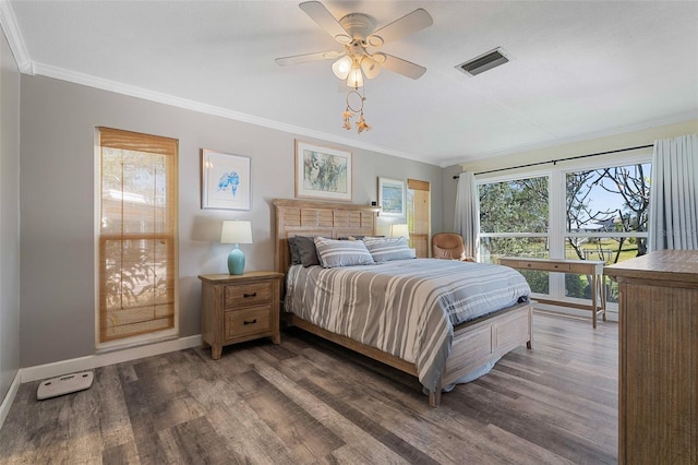 bedroom featuring ceiling fan, crown molding, and dark hardwood / wood-style floors