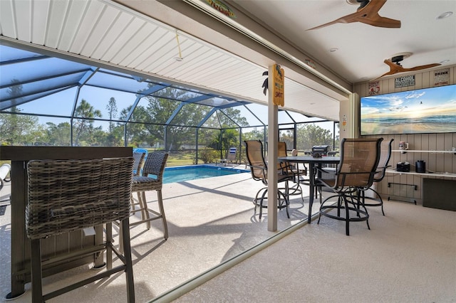 view of patio / terrace featuring glass enclosure and ceiling fan