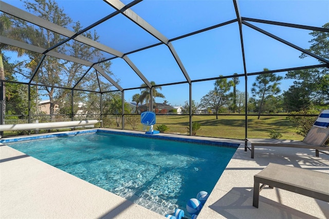 view of pool featuring glass enclosure and a patio area