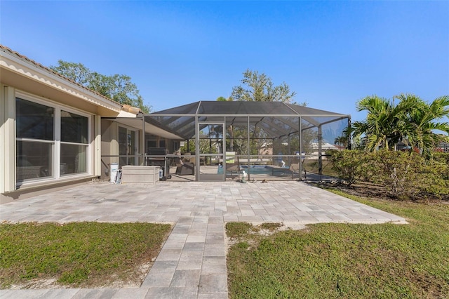 view of patio with glass enclosure