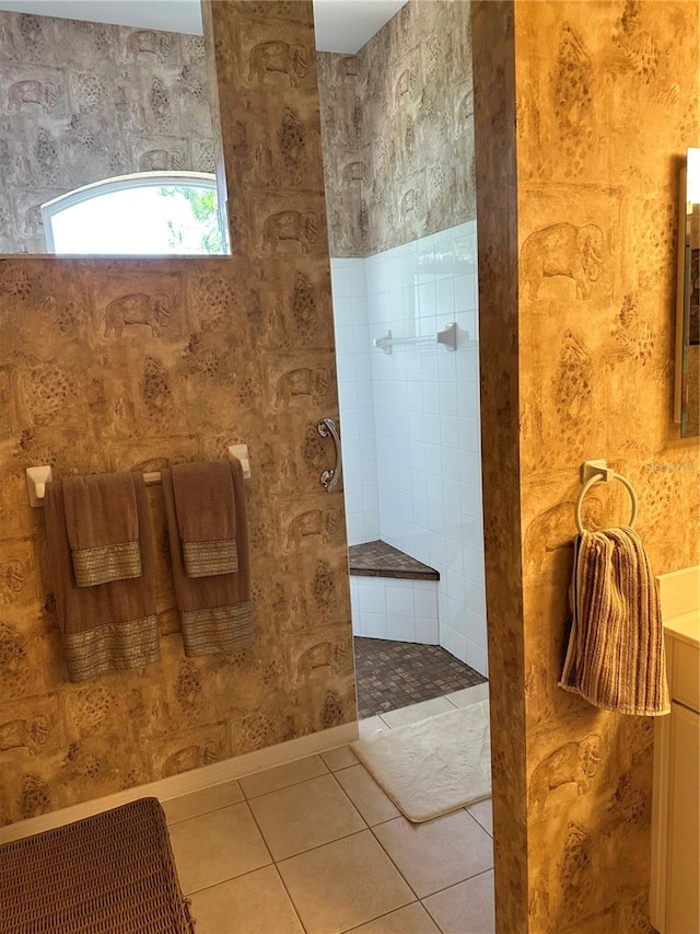 full bathroom with tile patterned flooring, walk in shower, and vanity