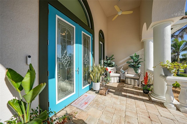 view of exterior entry featuring ceiling fan