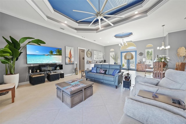 living room featuring light tile patterned floors, an inviting chandelier, a raised ceiling, and crown molding