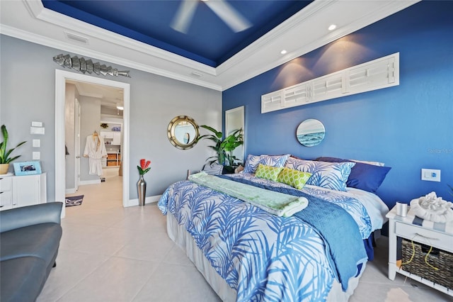 bedroom with a tray ceiling, ceiling fan, light tile patterned floors, and ornamental molding