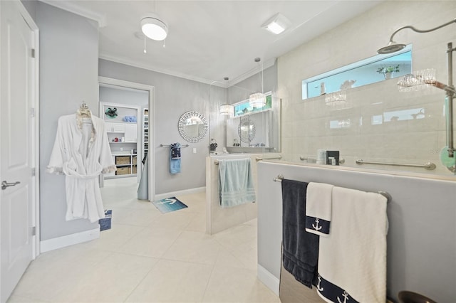 bathroom featuring tile patterned flooring, vanity, ornamental molding, and walk in shower