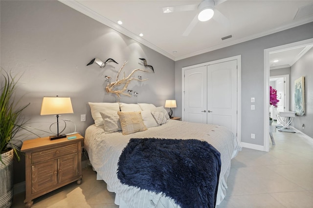 tiled bedroom featuring a closet, ceiling fan, and ornamental molding