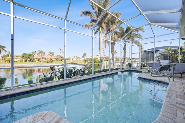 view of swimming pool featuring a lanai and a water view