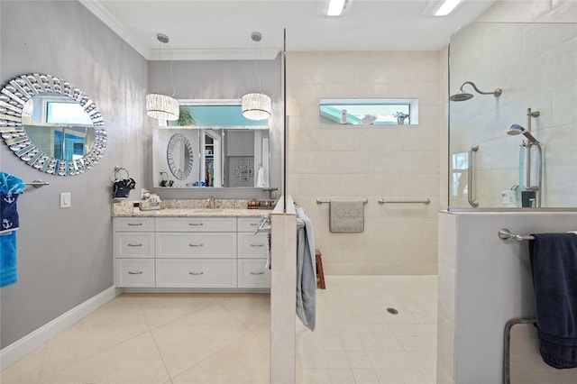 bathroom with vanity, baseboards, tile patterned floors, walk in shower, and crown molding