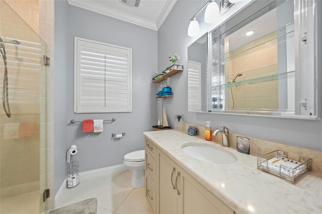 bathroom with crown molding, toilet, a stall shower, vanity, and tile patterned flooring