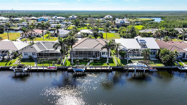 bird's eye view featuring a water view and a residential view