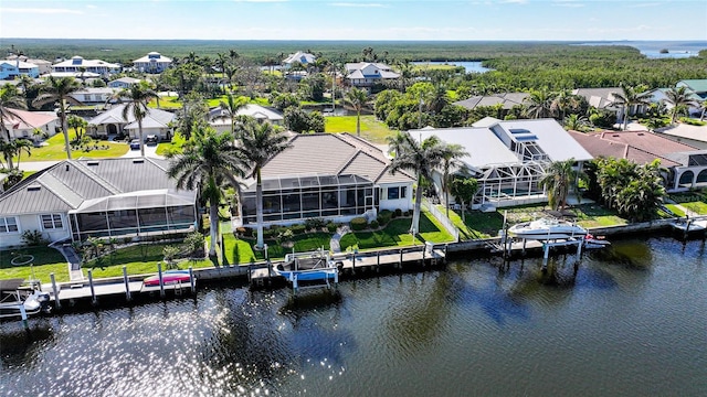 bird's eye view featuring a water view and a residential view