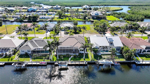 aerial view featuring a residential view and a water view