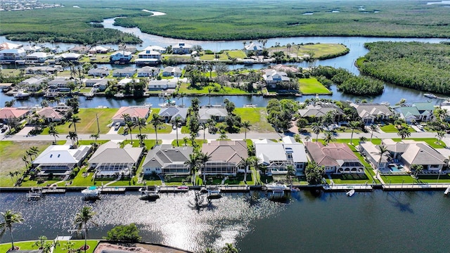 bird's eye view with a water view and a residential view