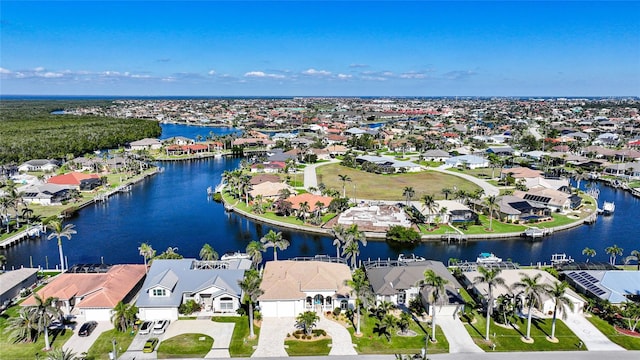 drone / aerial view with a water view and a residential view