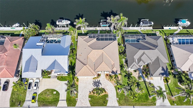 drone / aerial view with a residential view and a water view