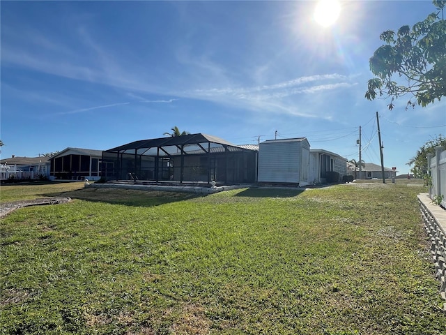 view of yard with a lanai