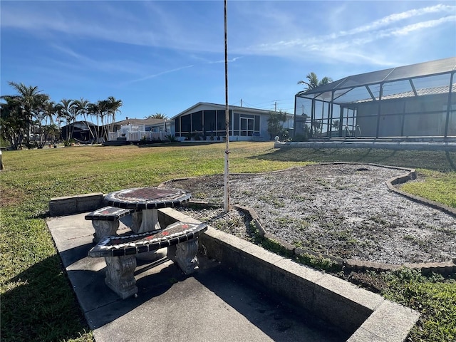 view of yard featuring a lanai