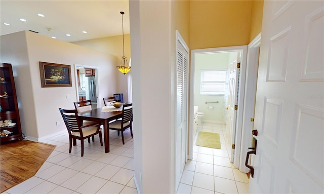 corridor featuring light tile patterned floors