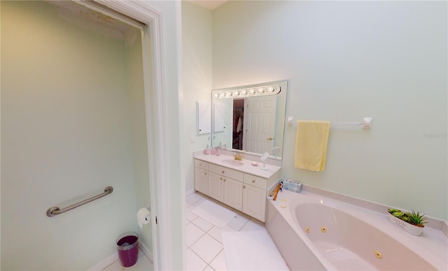 bathroom featuring tile patterned floors, vanity, and a tub