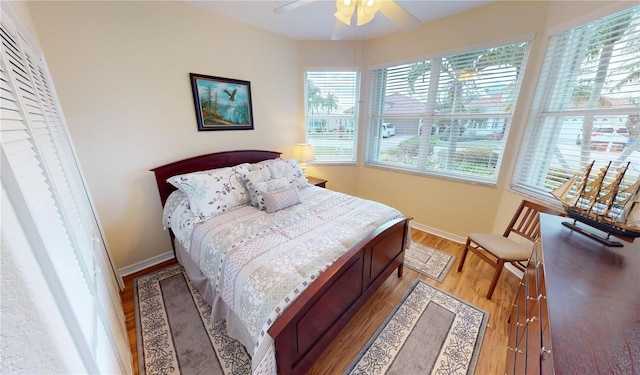 bedroom featuring ceiling fan and light hardwood / wood-style floors