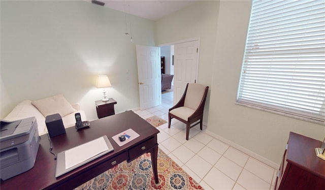 office featuring a wealth of natural light and light tile patterned flooring